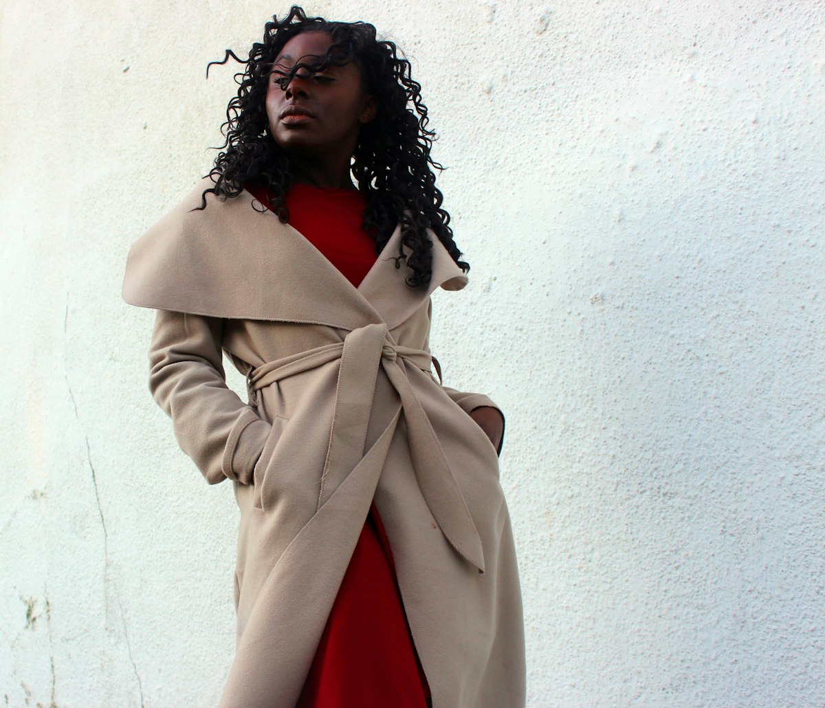 Cream wool coat draped on model